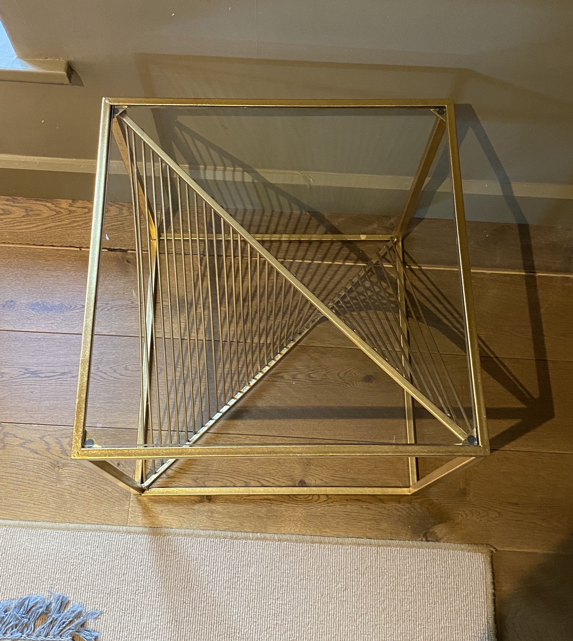 A pair of gold painted metal glass top occasional tables, with wirework underframes, width 52cm depth 52cm height 53cm